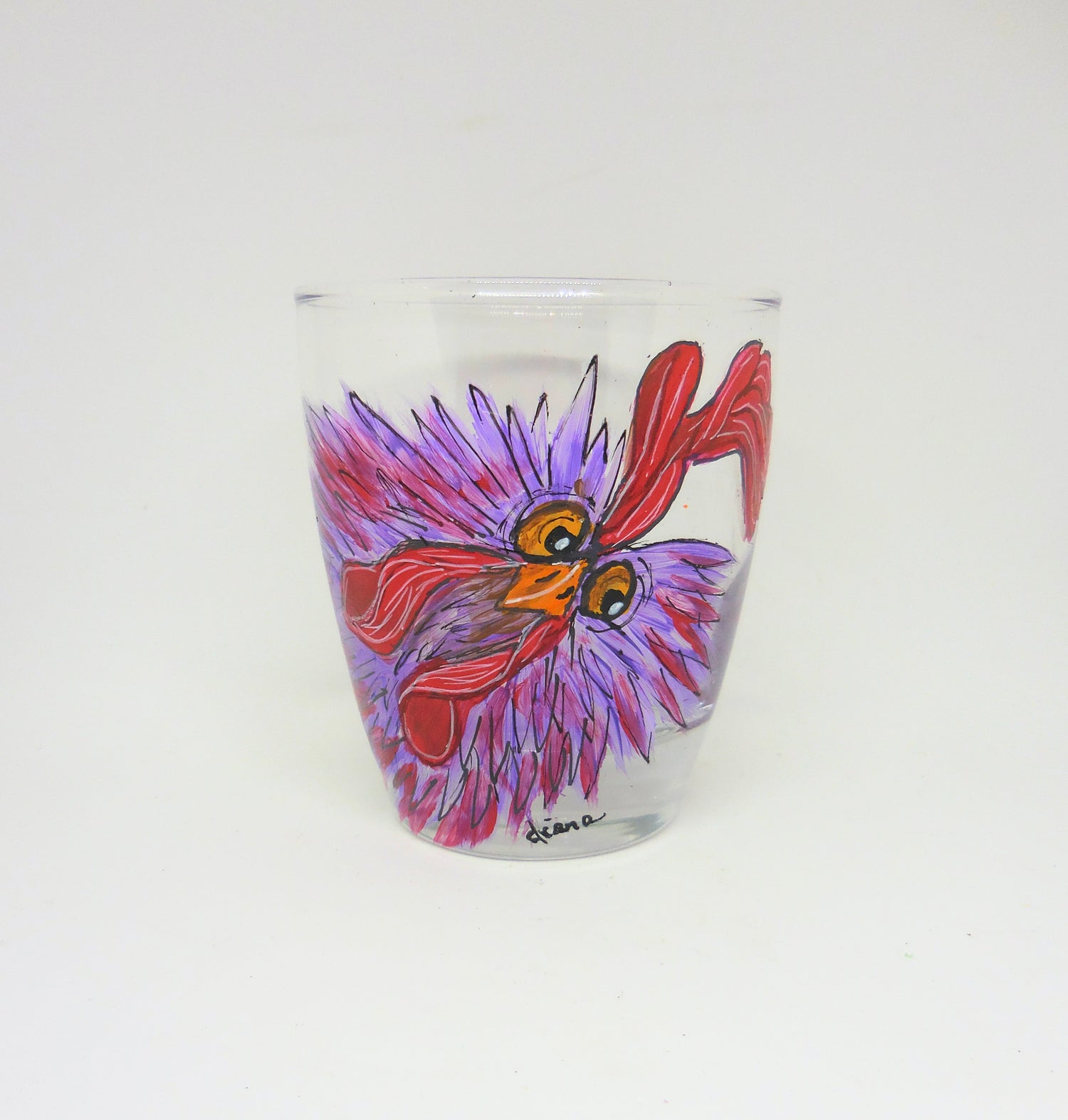 tall glass with a crazy-looking purple chicken design