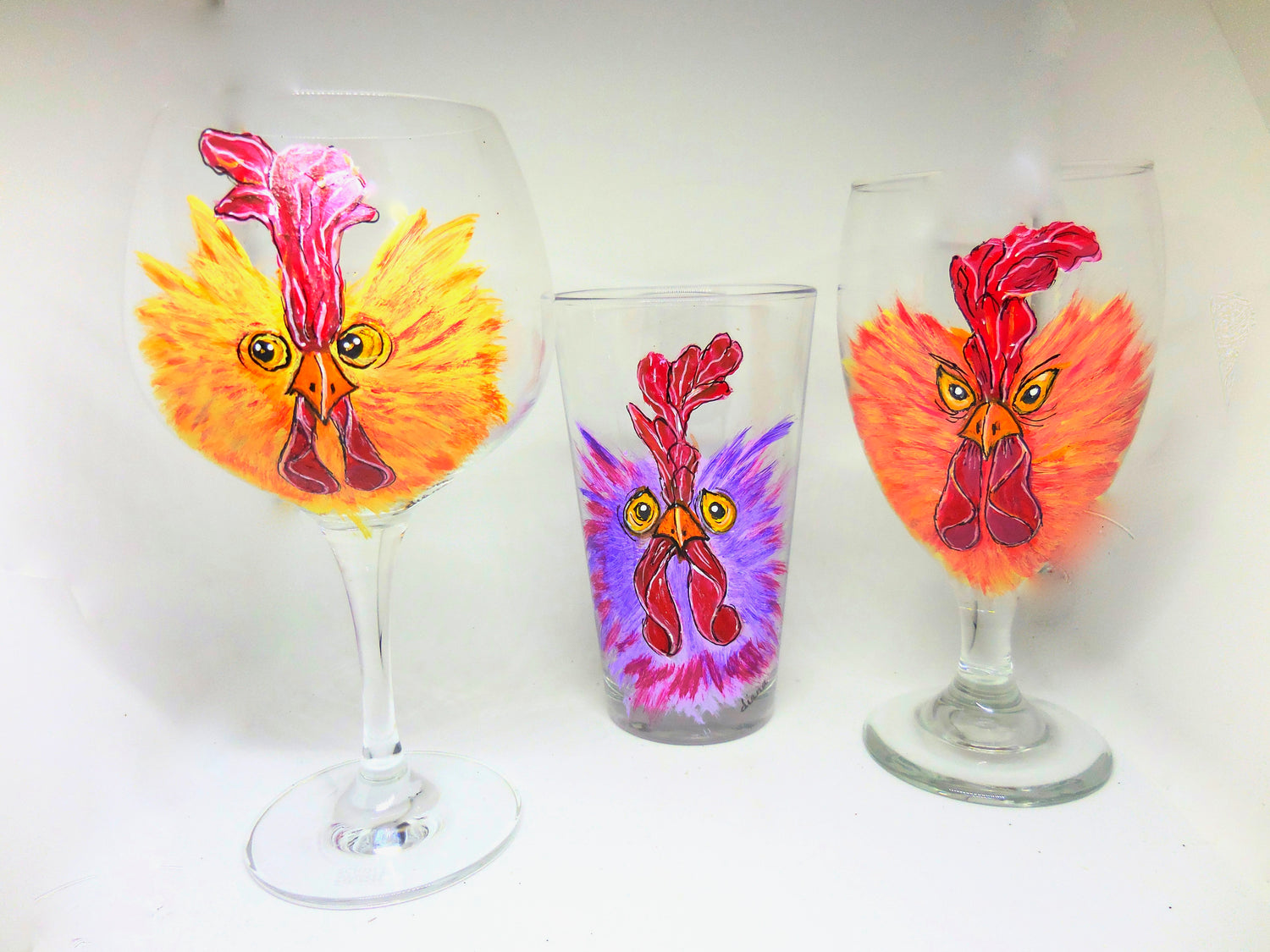 tall glass with a crazy-looking purple chicken design