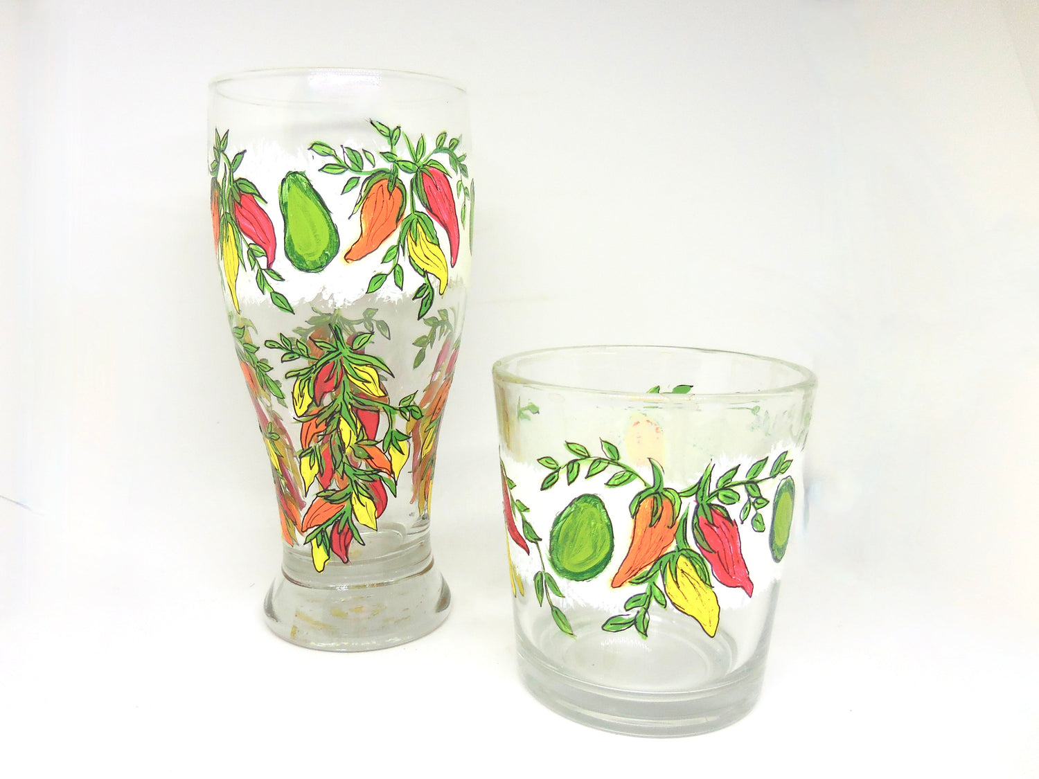 two glasses with chili pepper designs