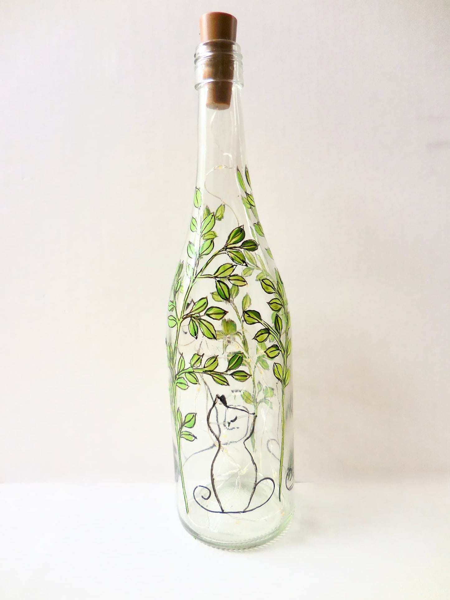 Aloof Cat in Leaves Lighted Wine Bottle