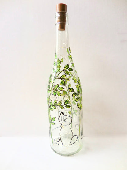 Aloof Cat in Leaves Lighted Wine Bottle