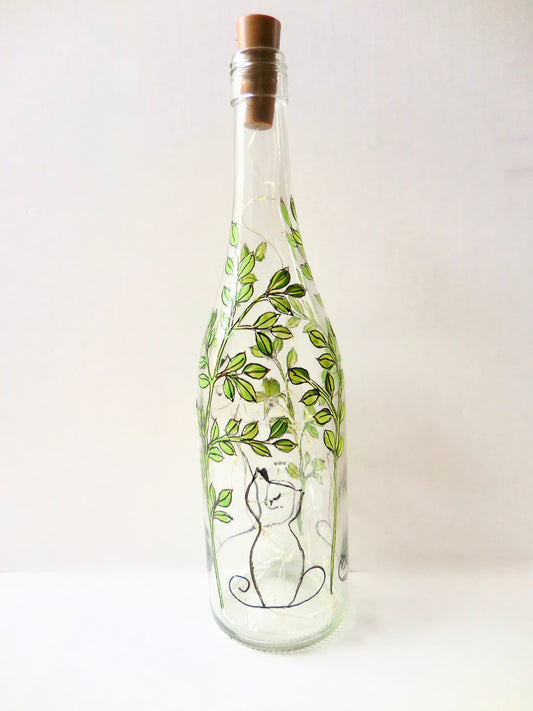 Aloof Cat in Leaves Lighted Wine Bottle