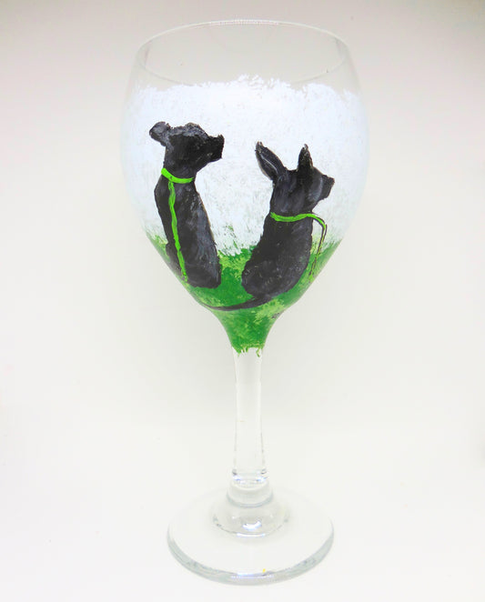 Wine Glass featuring Two Black Dogs on Leash