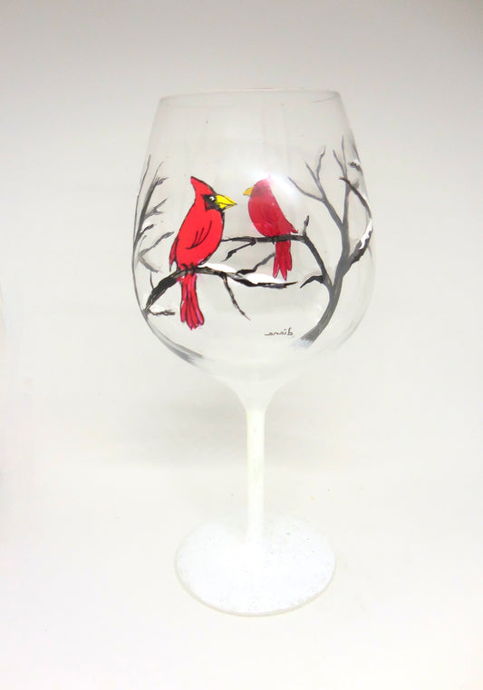 wine glass with cardinal in snow