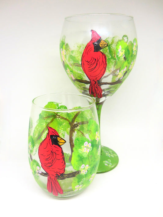 two wine glasses with cardinals