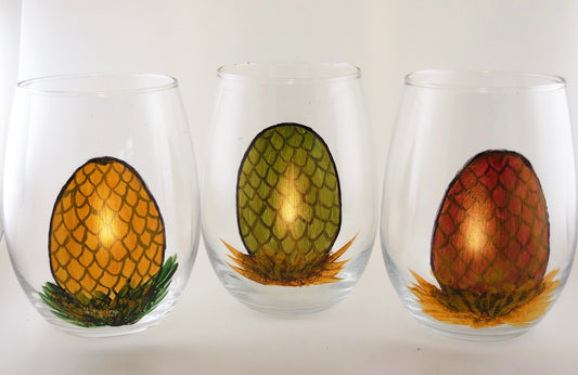 3 stemless wine glasses with dragon egg designs