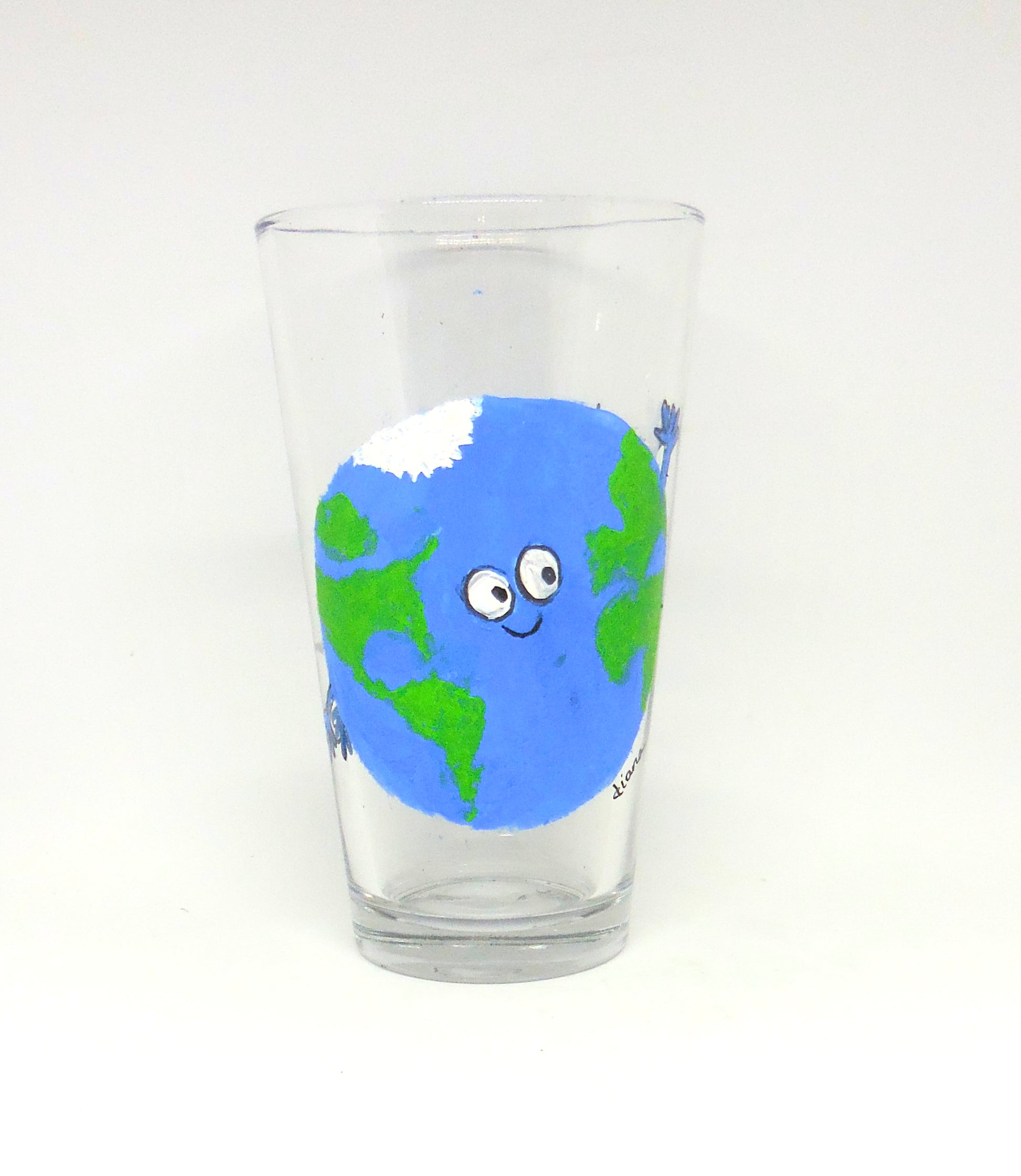 tall glass with cartoon earth design