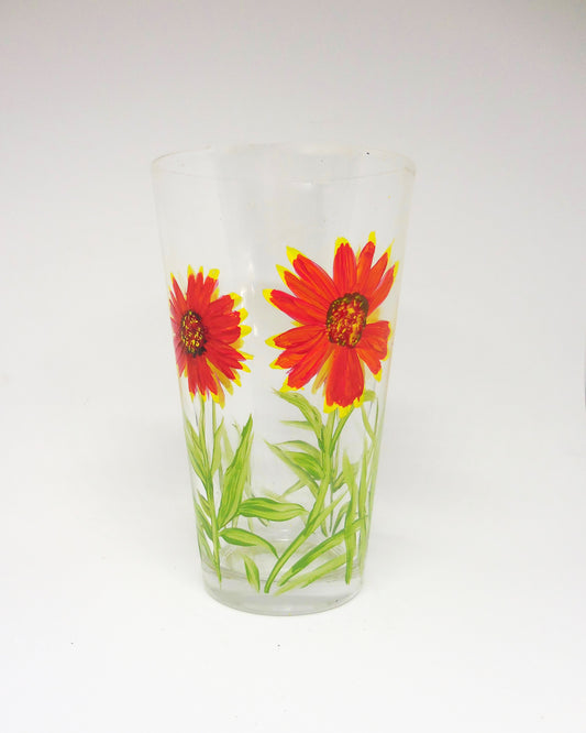 water glass with red and yellow flowers