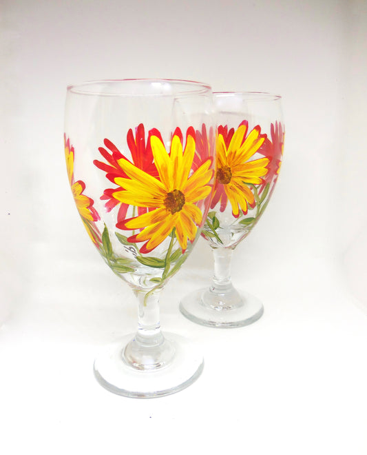 glass goblets with red and yellow flowers