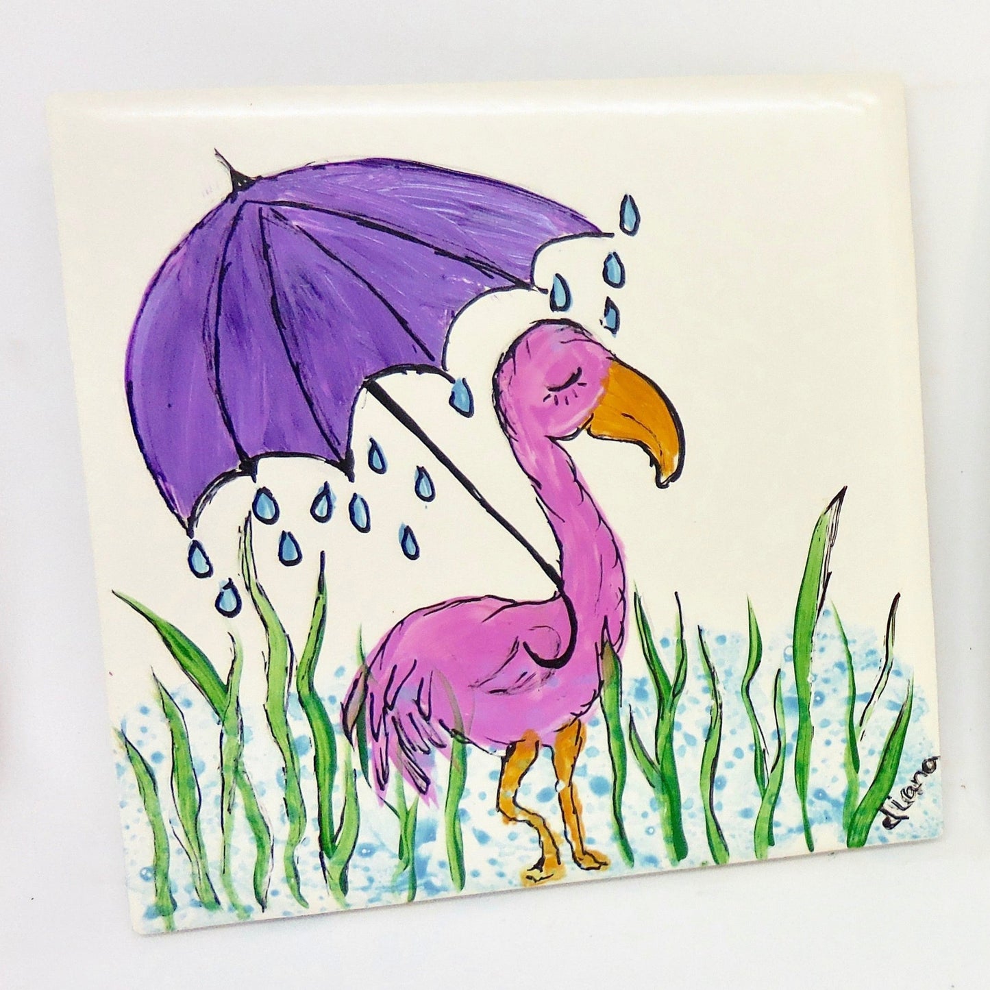 two ceramic coasters with flamingos