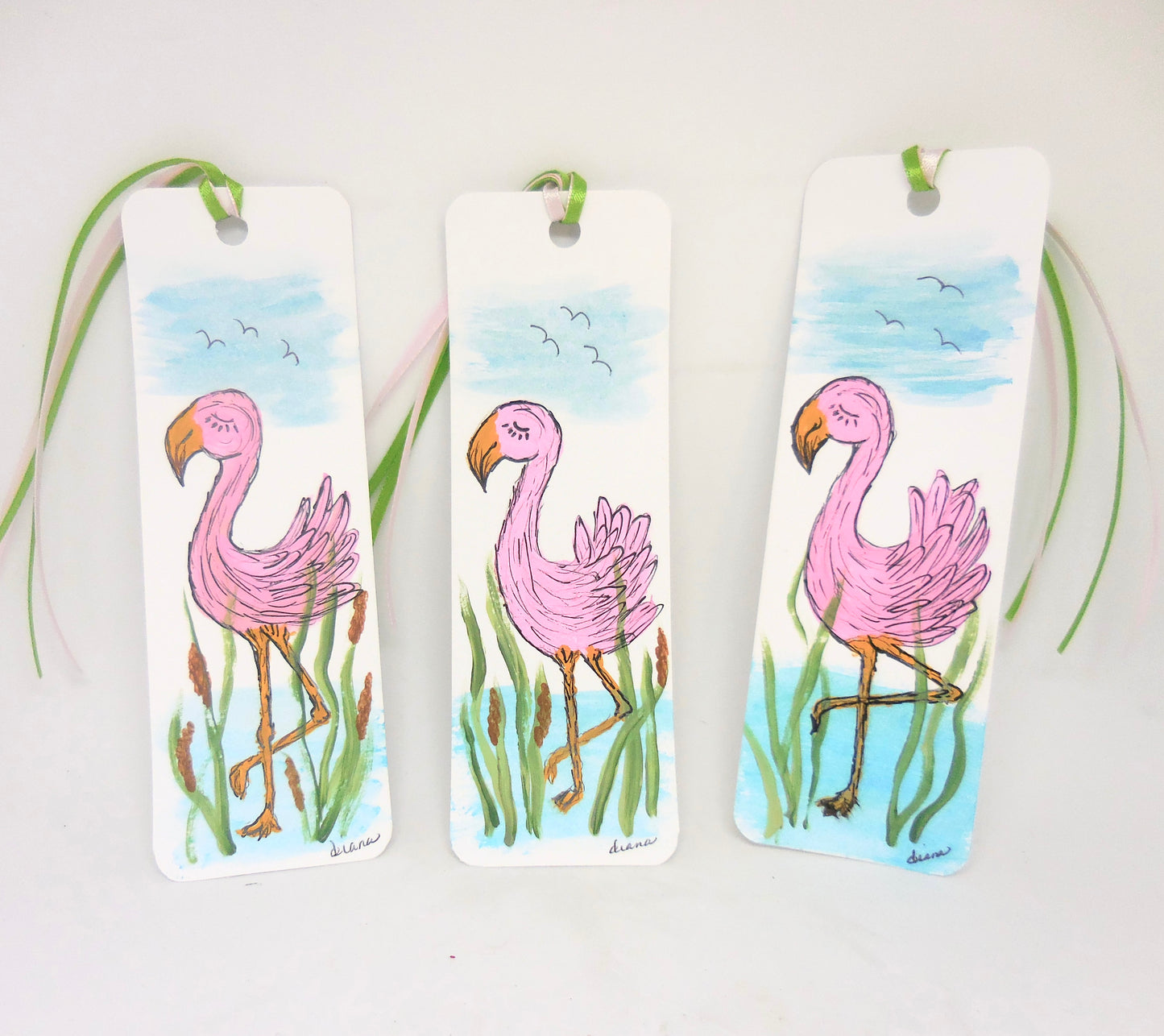 three bookmarks with flamingo designs