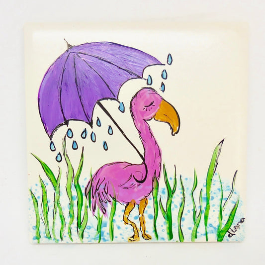 coaster with flamingo in the rain