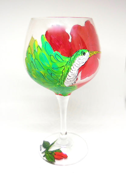 wine glass with red flower and green hummingbird