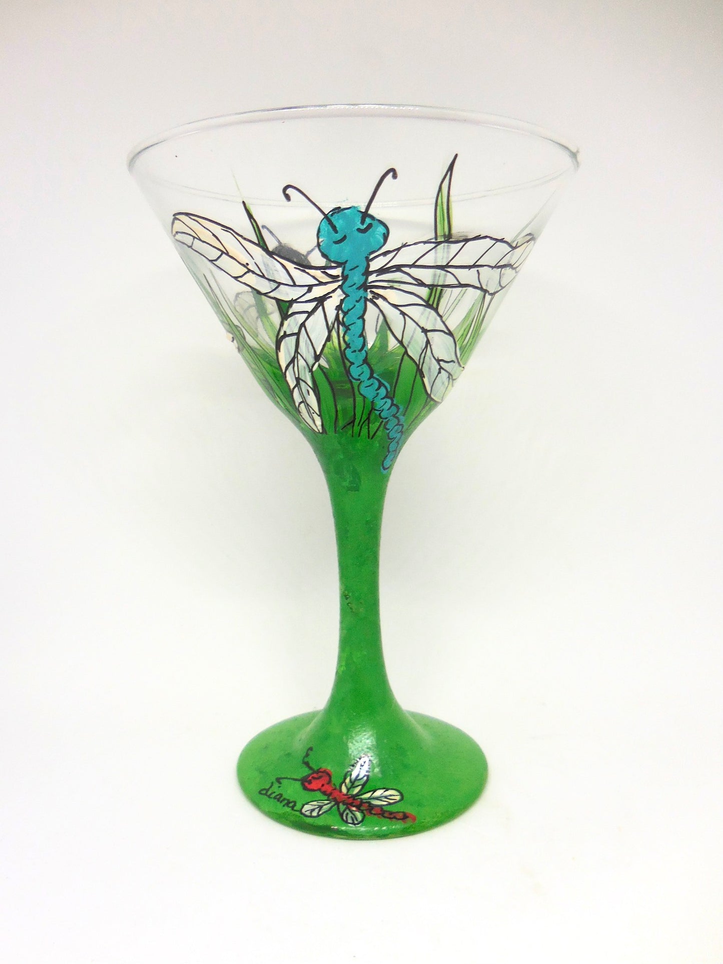 martini glass with blue dragonfly